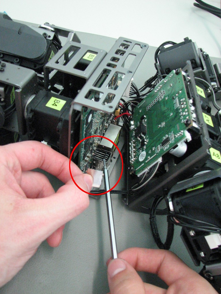 Picture showing the back-cover of the USB-Port and the USB-Port after removing